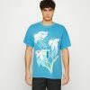 BDG Urban Outfitters PAINT TEE UNISEX - Print T-shirt - Blue 1 BDG Urban Outfitters PAINT TEE UNISEX - Print T-shirt - Blue -BDG Urban Outfitters shop 745886687216496aae0d1c46e12f929c
