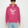 BDG Urban Outfitters DIVISION EAGLE HOODIE UNISEX - Hoodie - Magenta -BDG Urban Outfitters shop b10359f2cca04bbdacb0af97619fe7ee
