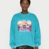 BDG Urban Outfitters WILD RIDE UNISEX - Sweatshirt - Teal -BDG Urban Outfitters shop d573e93b999a4c8cb2a83c0aad3b9bf2