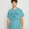 BDG Urban Outfitters PRINTED TEE UNISEX - Print T-shirt - Washed Blue -BDG Urban Outfitters shop fd82e3605a284508b304fdf9a5770beb